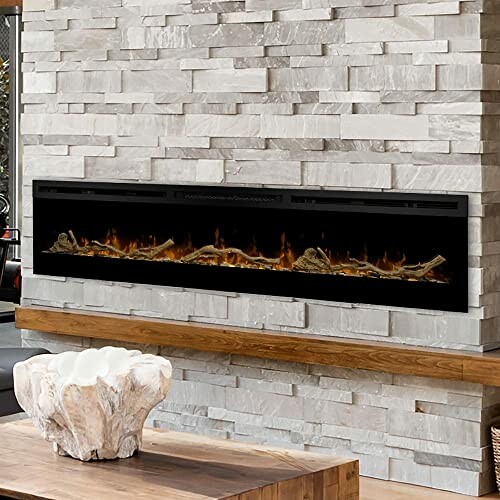 Modern electric fireplace mounted on a stone wall.