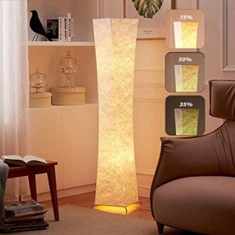 Modern floor lamp in a cozy living room with adjustable brightness settings.