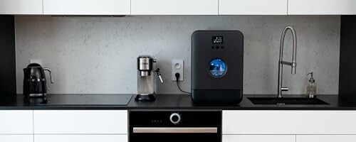 Modern kitchen with coffee machine and water filtration system.