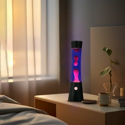 Lava lamp on bedside table in cozy bedroom setting