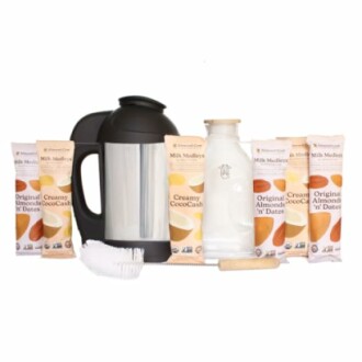 Nut milk maker kit with various milk mix packets and accessories.