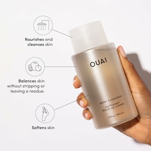 Hand holding Ouai body cleanser with features highlighted.