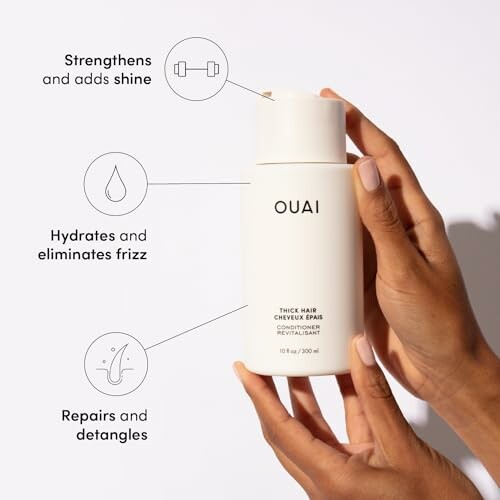 Hands holding Ouai thick hair conditioner with benefits highlighted.