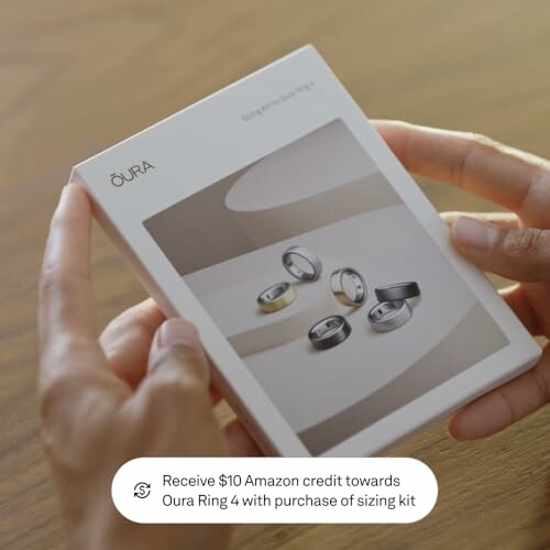 Hands holding Oura Ring sizing kit box.