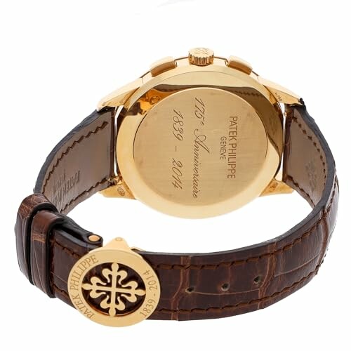 Patek Philippe 175th Anniversary gold watch with leather strap.