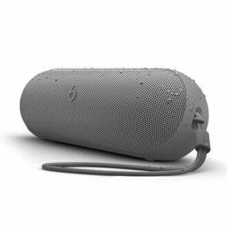 Gray portable waterproof speaker with strap.