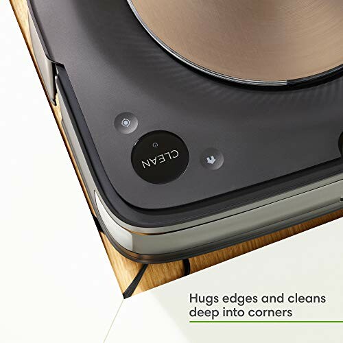 Robot vacuum cleaner cleaning a corner with text 'Hugs edges and cleans deep into corners'.