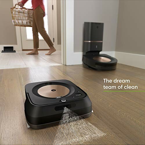 Robot vacuum and mop in a room with a person in the background.