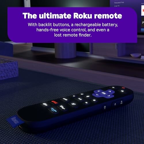 Roku remote with backlit buttons on a table