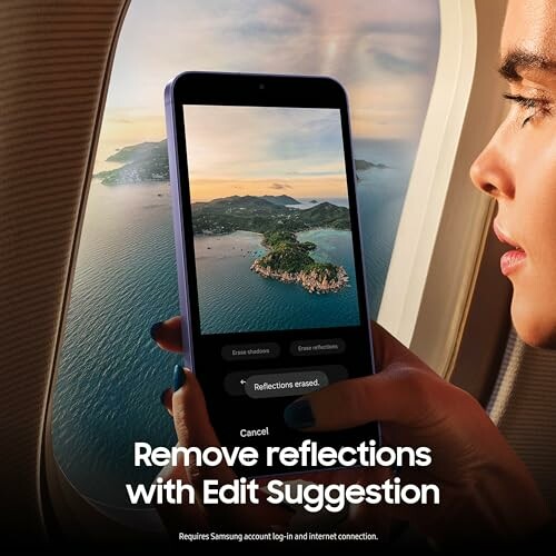 Person using Samsung phone to remove window reflections on a flight.