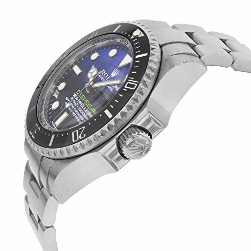 Silver dive watch with blue face and metal bracelet.