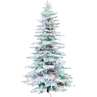 Snowy artificial Christmas tree with colorful lights