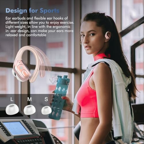 Woman at gym wearing sports earbuds and holding a water bottle.