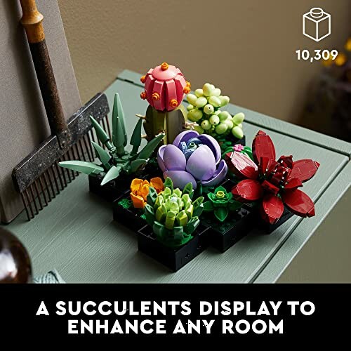 Lego succulent display on a table with gardening tools