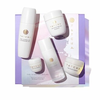 Tatcha skincare set with cleansing oil, cream, and rice polish.