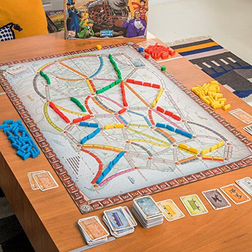 Ticket to Ride board game setup with map and colored train pieces.