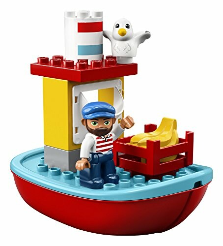 Toy boat with sailor figure and seagull