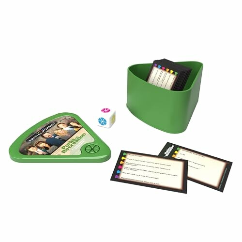 Trivia board game with cards, die, and green container.