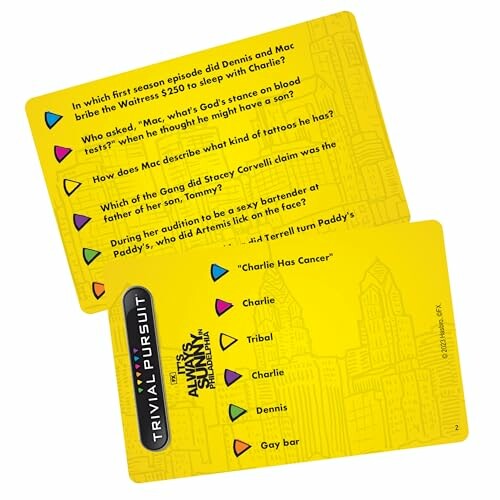 Yellow Trivial Pursuit cards with questions and answers.