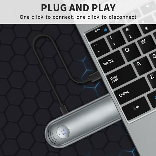 USB-C adapter connected to laptop keyboard