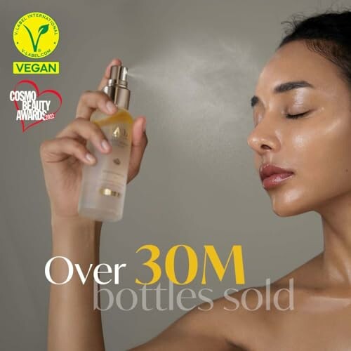 Woman using vegan beauty spray with over 30M bottles sold.