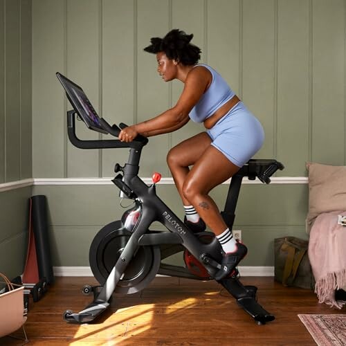 Woman exercising on a stationary bike at home