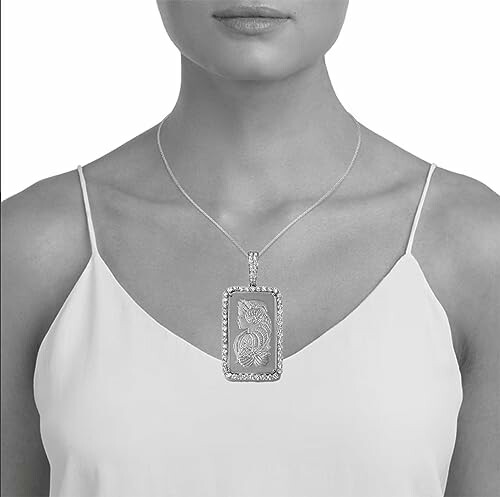 Woman wearing a large rectangular pendant necklace