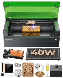 xTool laser engraver with various engraved items and accessories.