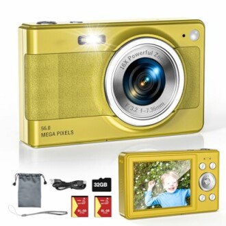 Yellow digital camera with accessories including memory cards and a carrying pouch.